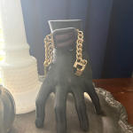 3D printed hand-shaped Apple Watch charging stand inspired by Thing from The Addams Family.